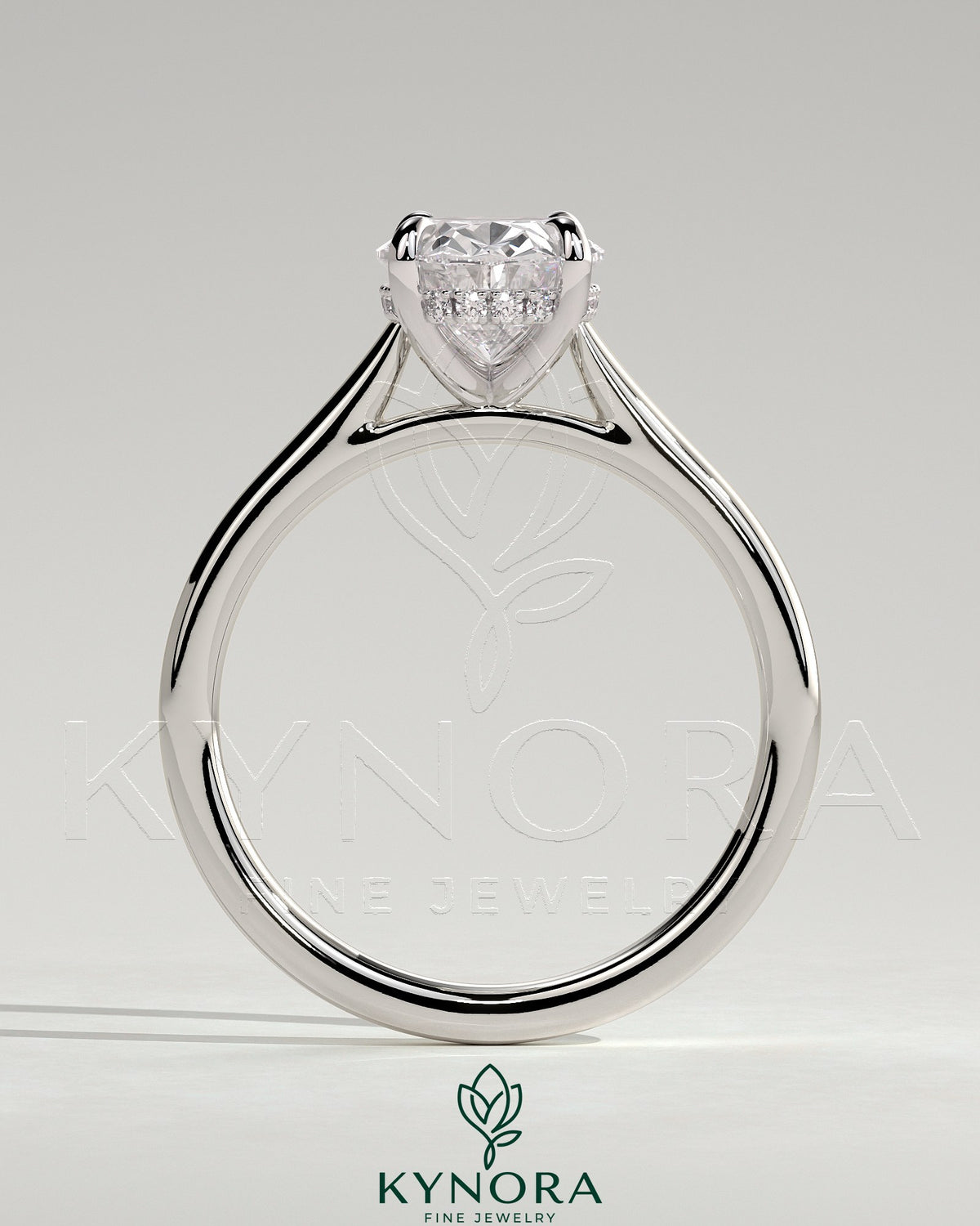 Kynora CJ 2ct oval claw solitaire engagement ring with hidden halo and cathedral high setting, showcasing intricate design and sparkling diamond.
