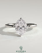Kynora CJ 2ct oval claw solitaire engagement ring with hidden halo and compass rotation in sterling silver.