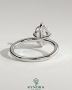 Kynora CJ 2ct oval claw solitaire engagement ring with hidden halo and compass rotation design, showcasing sparkling diamond details.