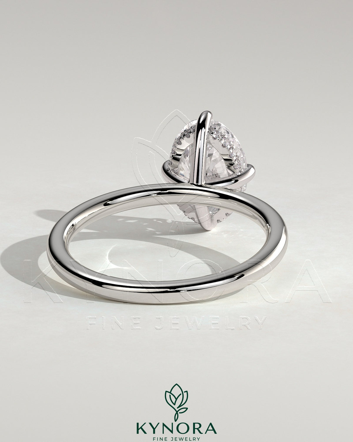 Kynora CJ 2ct oval claw solitaire engagement ring with hidden halo and compass rotation design, showcasing sparkling diamond details.