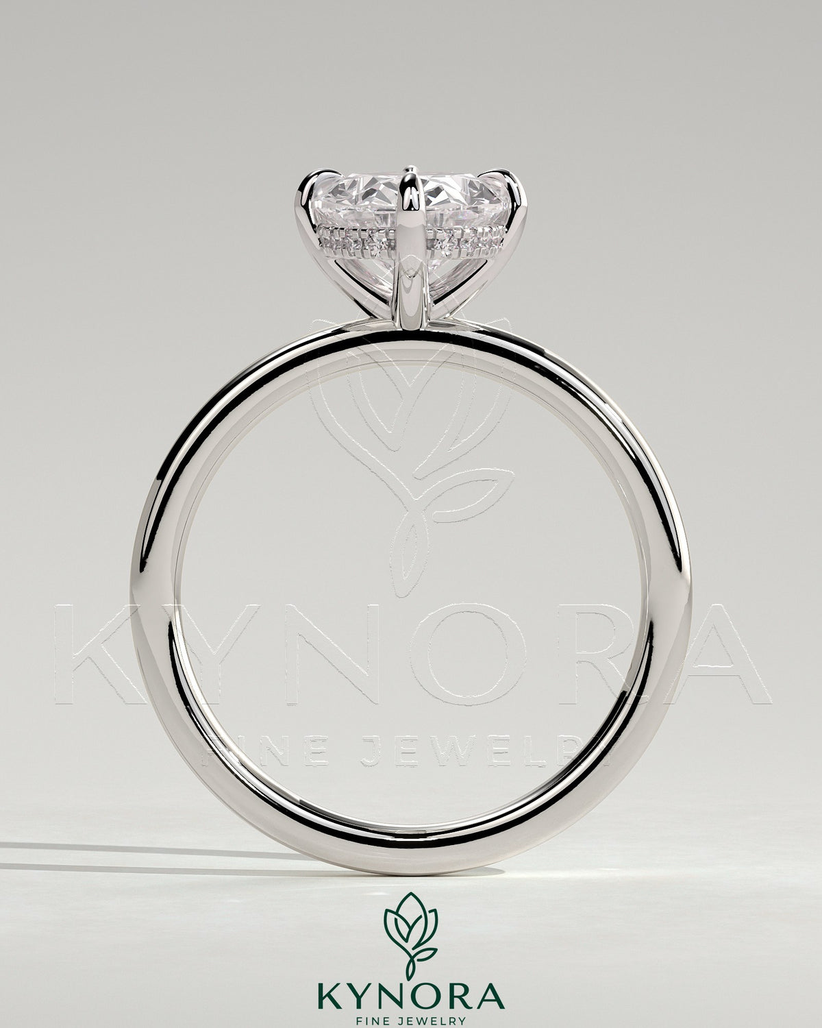 Kynora CJ 2ct oval claw solitaire engagement ring with hidden halo and compass rotation design, showcasing intricate craftsmanship.