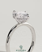 Kynora CJ 2ct oval claw solitaire engagement ring with hidden halo and compass rotation design, featuring a sparkling diamond center.