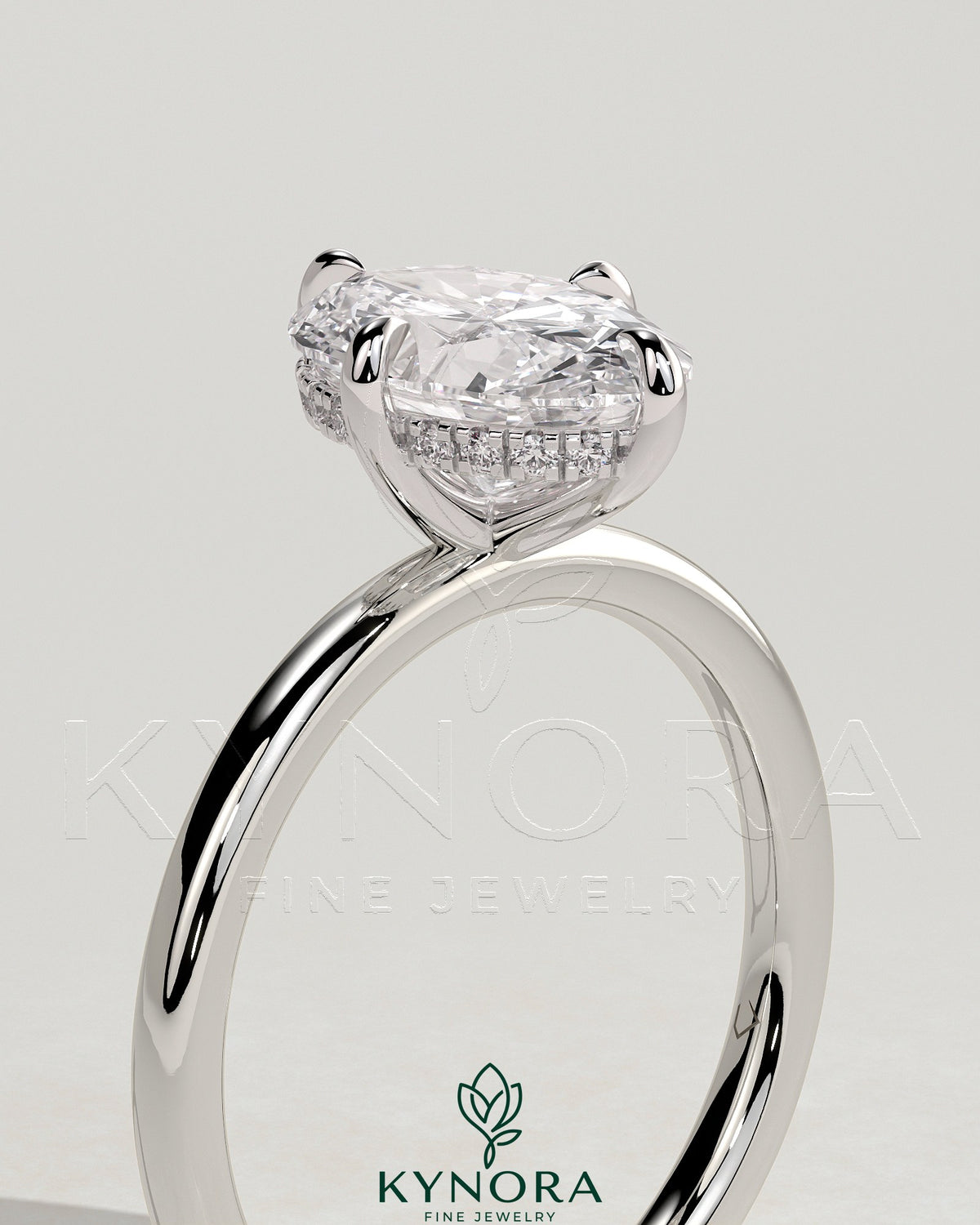 Kynora CJ 2ct oval claw solitaire engagement ring with hidden halo and compass rotation design, featuring a sparkling diamond center.