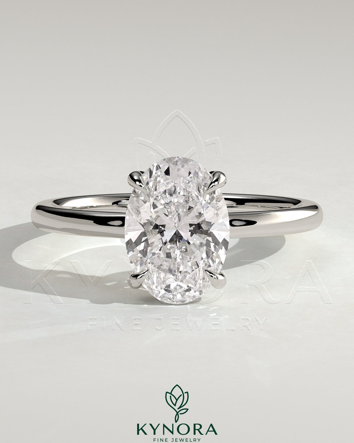 Kynora CJ 2ct oval claw solitaire engagement ring with hidden halo and floating cathedral low setting, showcasing elegant jewelry design.