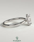 Kynora CJ 2ct oval claw solitaire engagement ring with hidden halo and floating cathedral low setting, showcasing elegant diamond design.