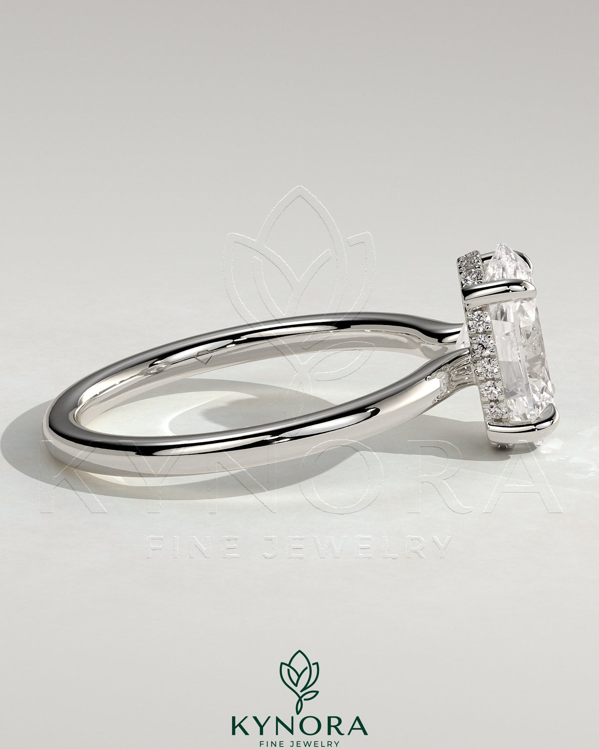 Kynora CJ 2ct oval claw solitaire engagement ring with hidden halo and floating cathedral low setting, showcasing elegant diamond design.