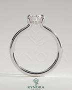 Kynora CJ 2ct oval claw solitaire engagement ring with hidden halo and floating cathedral low setting, showcasing elegant jewelry craftsmanship.