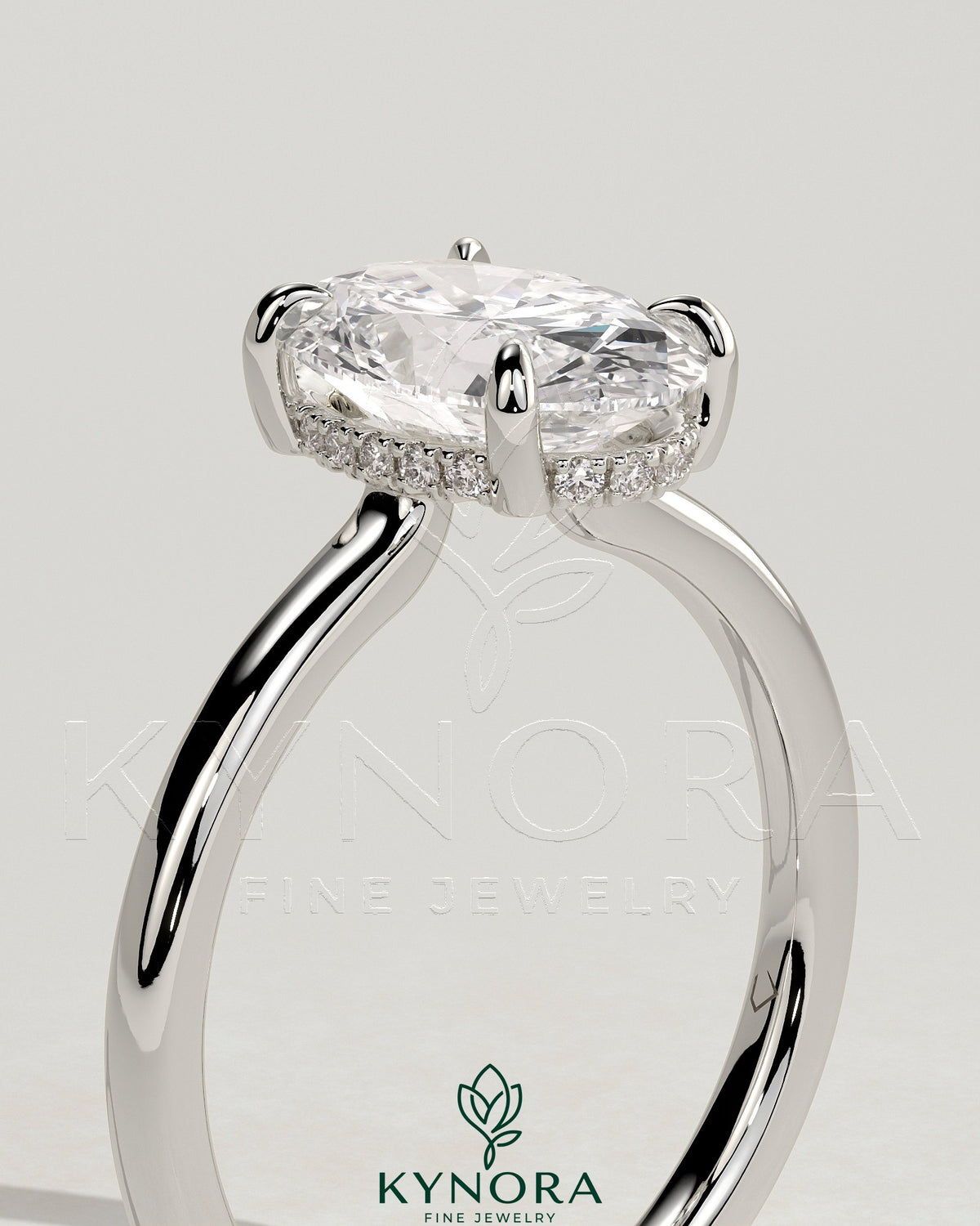 Kynora CJ 2ct oval claw solitaire engagement ring with hidden halo and floating cathedral low setting, showcasing elegant diamond design.