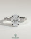Kynora CJ 2ct oval claw solitaire engagement ring with hidden halo and pave band, showcasing a sparkling central diamond.