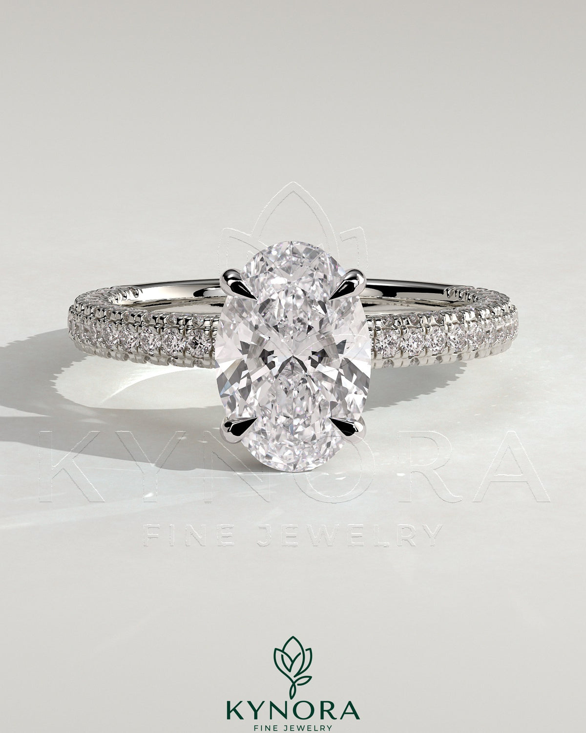 Kynora CJ 2ct oval claw solitaire engagement ring with hidden halo and triple pave band, showcasing sparkling diamond details. Main image