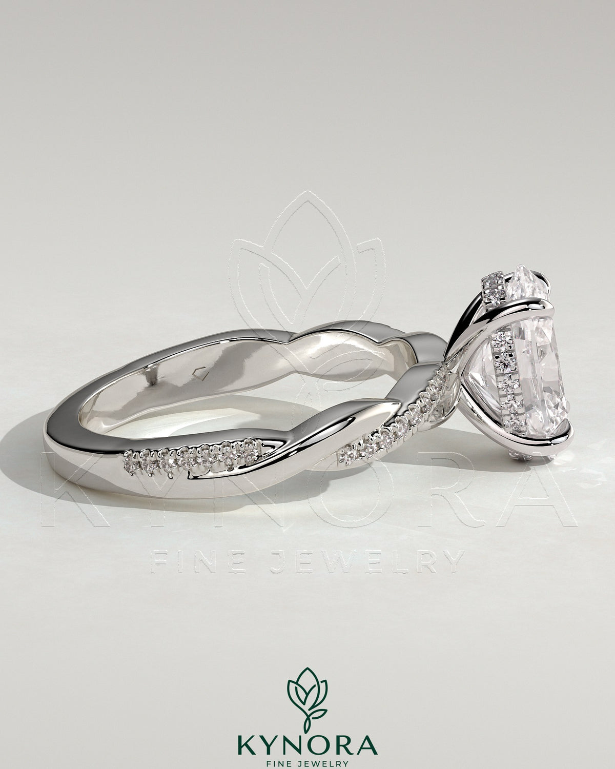 Kynora CJ 2ct oval claw solitaire engagement ring with hidden halo and twisted pave band, showcasing intricate design and sparkling diamonds.