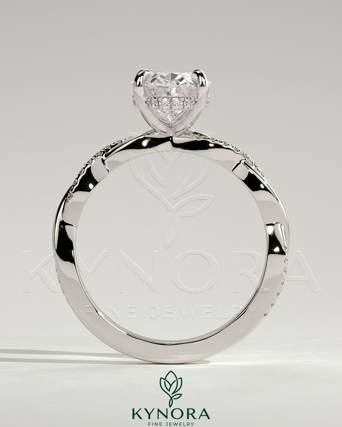 Kynora CJ 2ct oval claw solitaire engagement ring with hidden halo and twisted pave band, showcasing intricate diamond detailing.