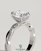 Kynora CJ 2ct oval claw solitaire engagement ring with hidden halo and twisted pave band, showcasing elegant diamond craftsmanship.