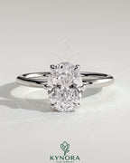 Kynora CJ 2ct oval claw solitaire engagement ring with hidden halo, showcasing a sparkling oval diamond and elegant design.