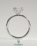 Kynora CJ 2ct oval claw solitaire engagement ring with hidden halo, featuring a sparkling center stone and elegant design.
