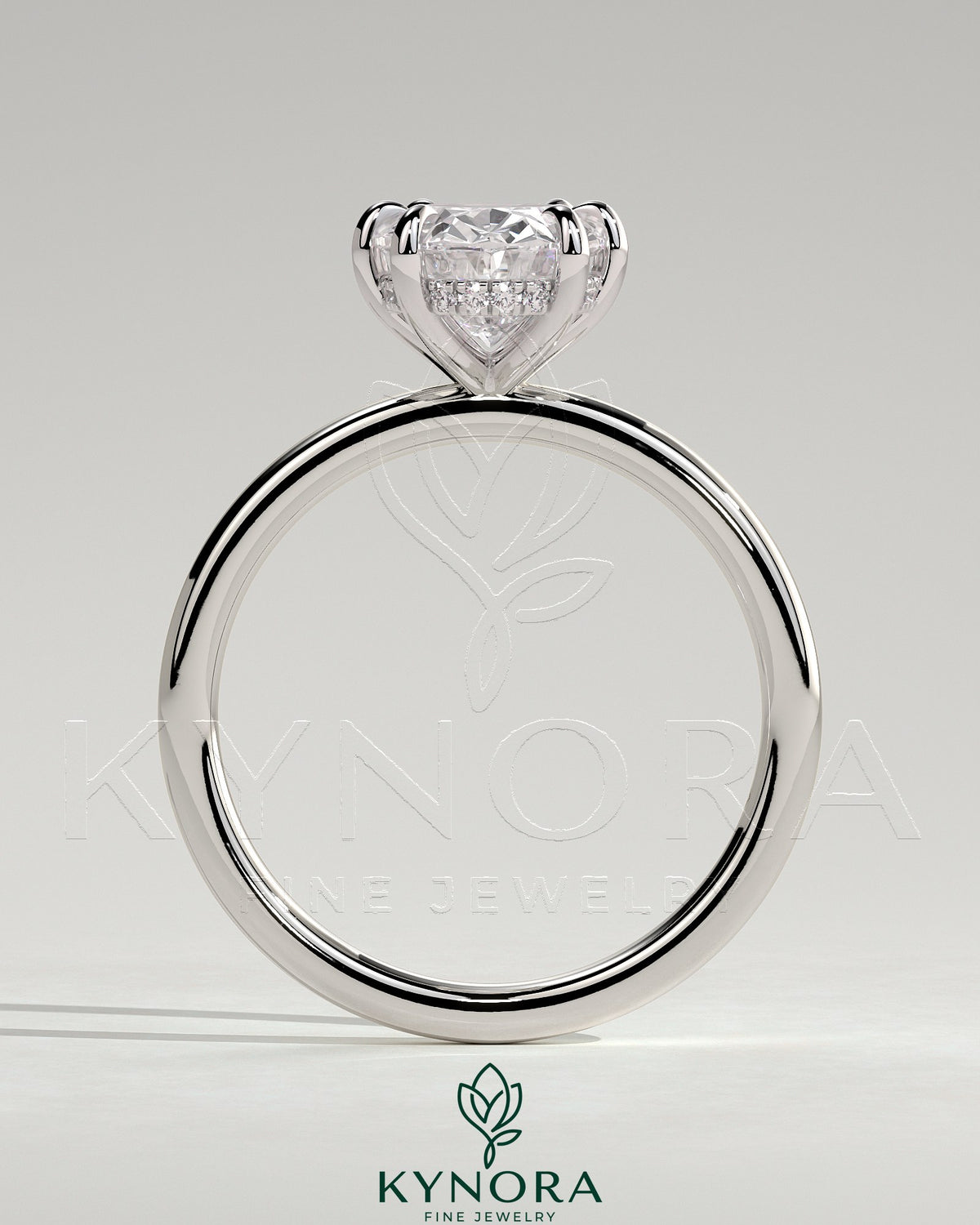 Kynora CJ 2ct oval claw solitaire engagement ring with hidden halo, featuring a sparkling center stone and elegant design.