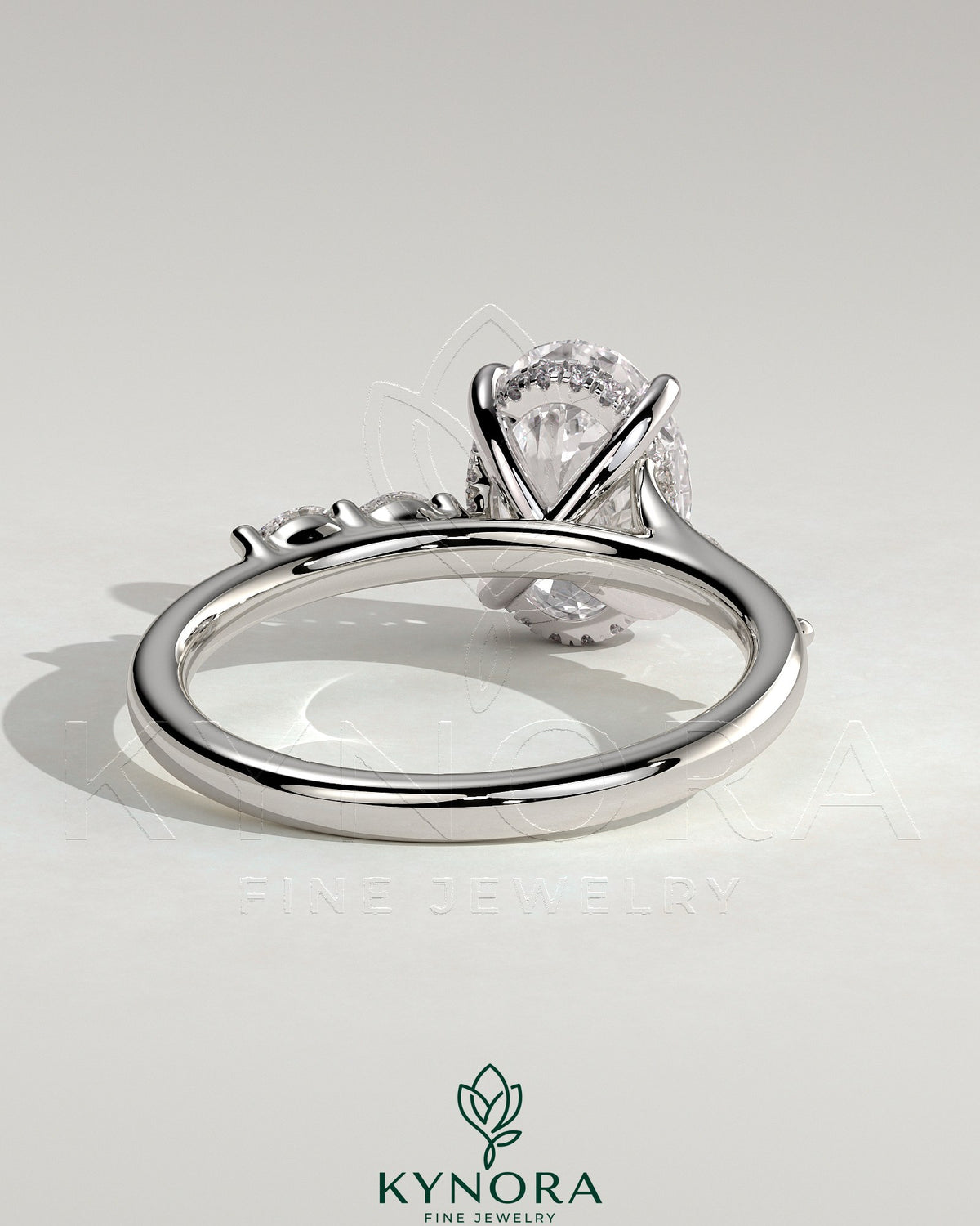 Kynora CJ 2ct oval claw solitaire engagement ring with hidden halo, opposing marquise accents, cathedral high setting, elegant jewelry