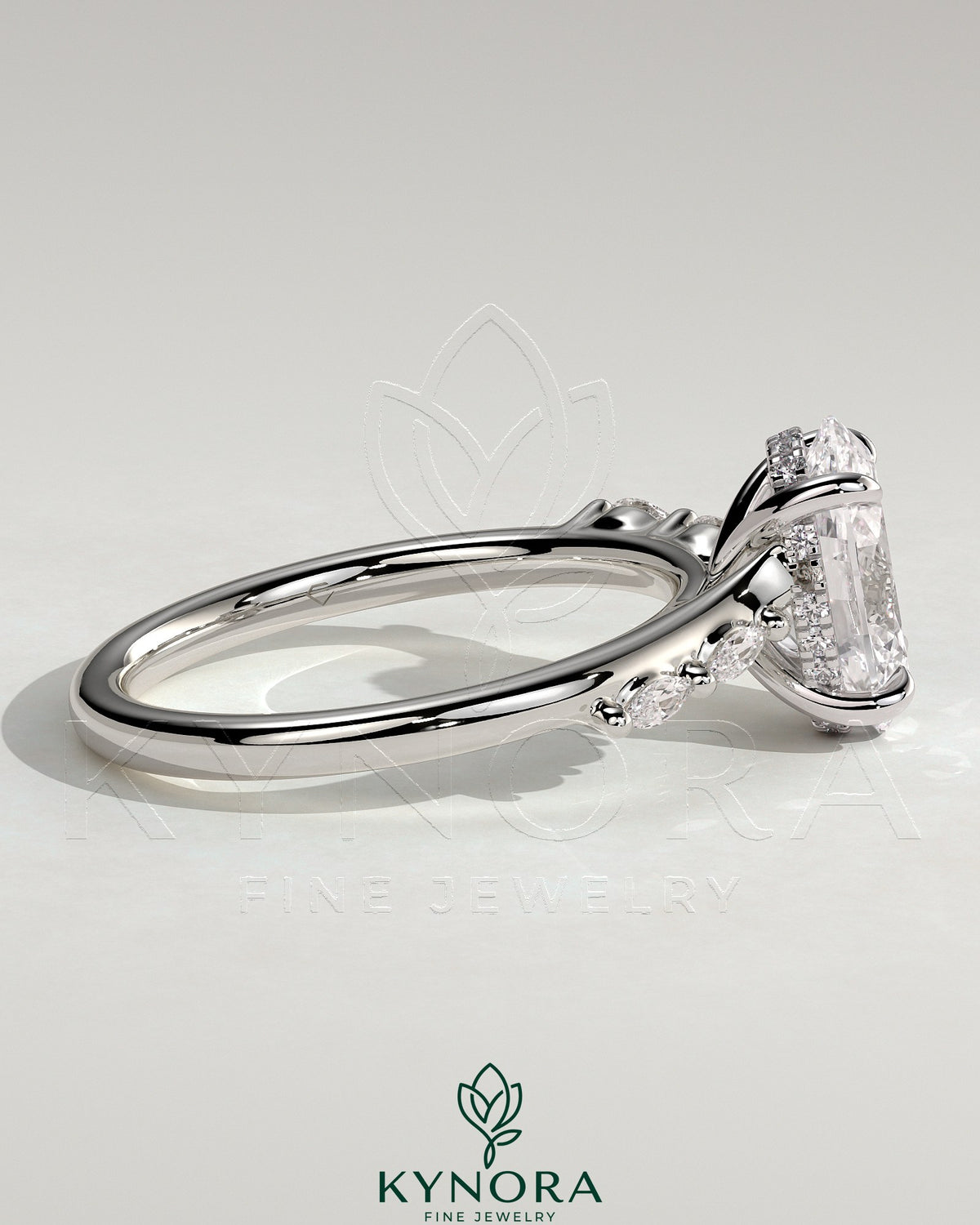 Kynora CJ 2ct oval claw solitaire engagement ring with hidden halo, opposing marquise accents, and cathedral high setting.