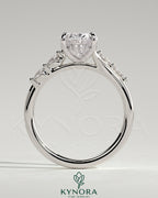 Kynora CJ 2ct oval claw solitaire engagement ring with hidden halo, opposing marquise accents, cathedral high setting.