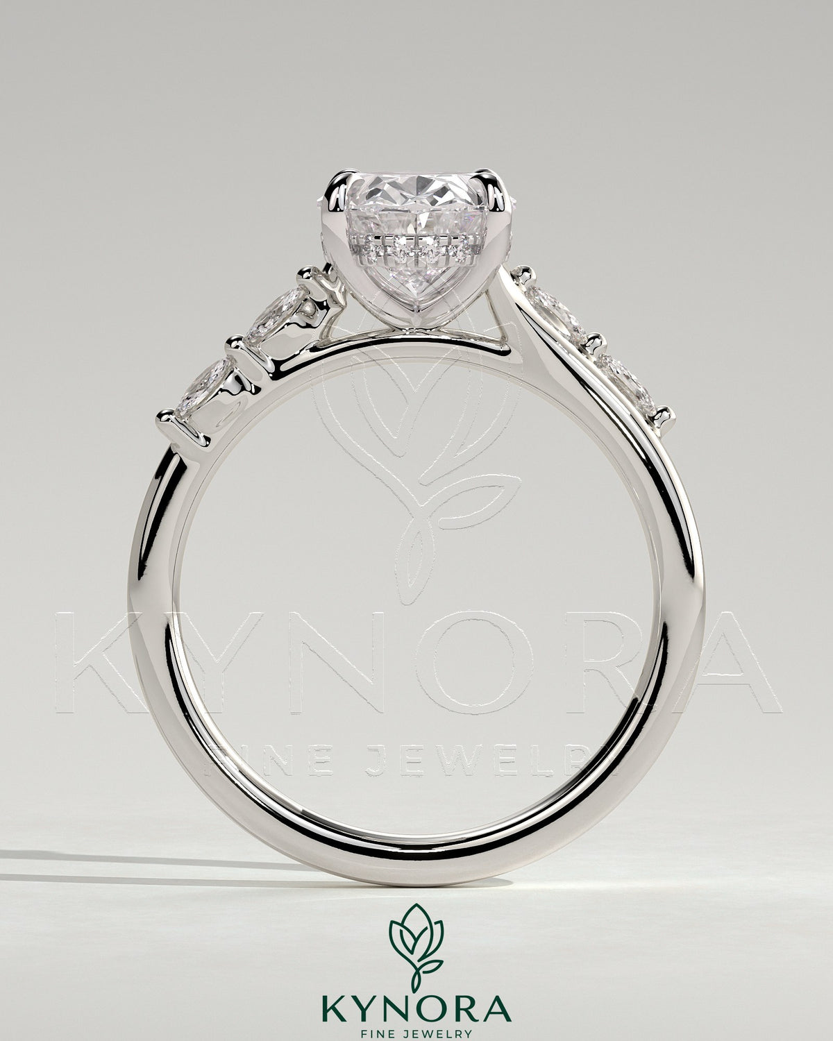 Kynora CJ 2ct oval claw solitaire engagement ring with hidden halo, opposing marquise accents, cathedral high setting.