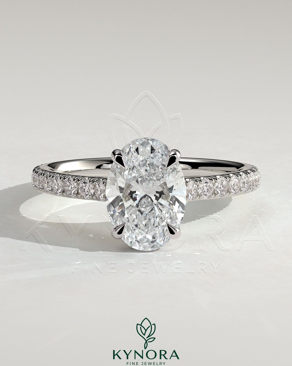 Kynora CJ 2ct oval claw solitaire engagement ring with hidden halo, pave band, and cathedral high setting, showcasing elegant jewelry design.