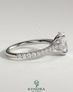 Kynora CJ 2ct oval claw solitaire engagement ring with hidden halo, pave band, and cathedral high setting, showcasing elegant jewelry design.