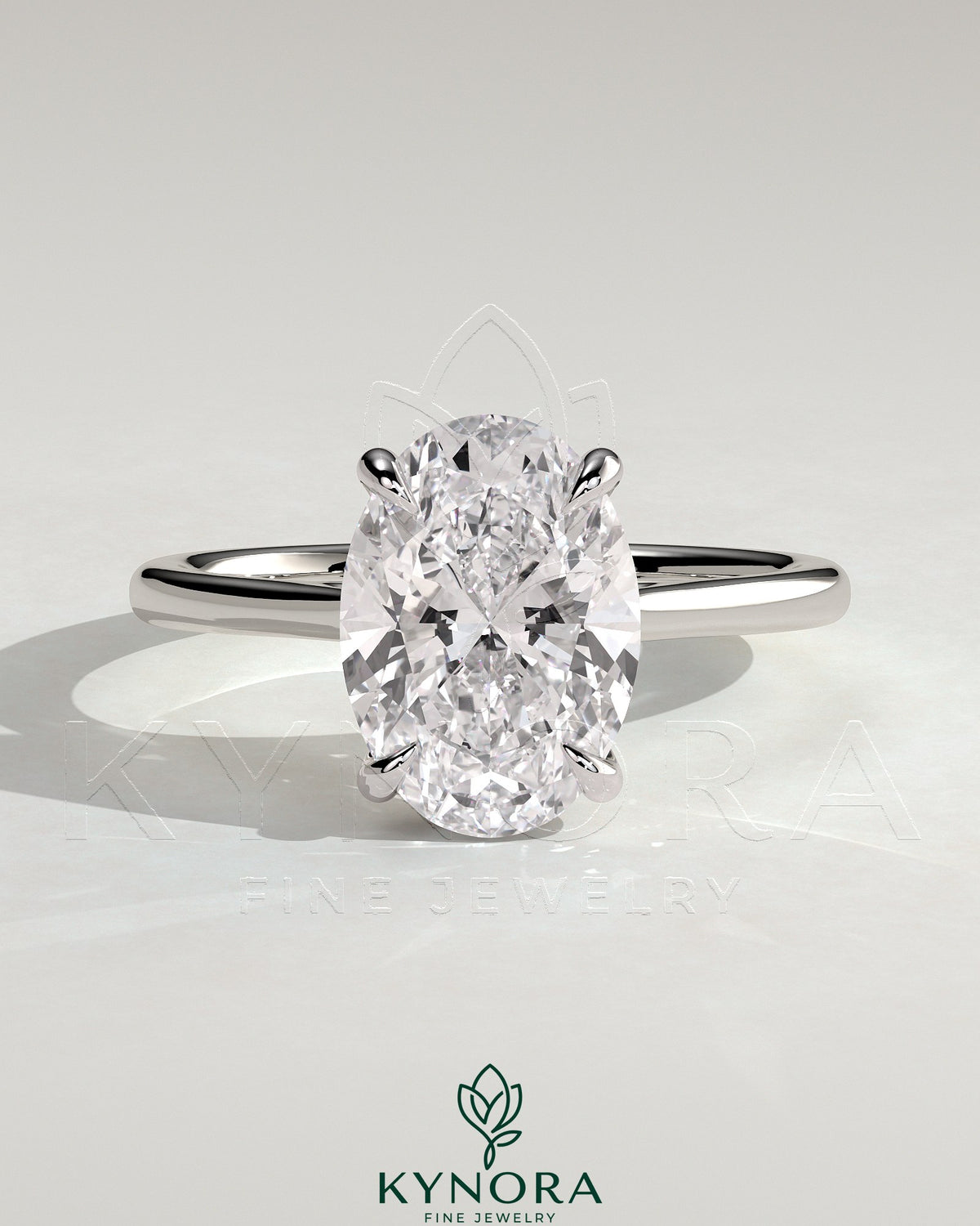 Kynora CJ 2ct oval claw solitaire engagement ring with hidden halo, tapered band, and cathedral high setting.
