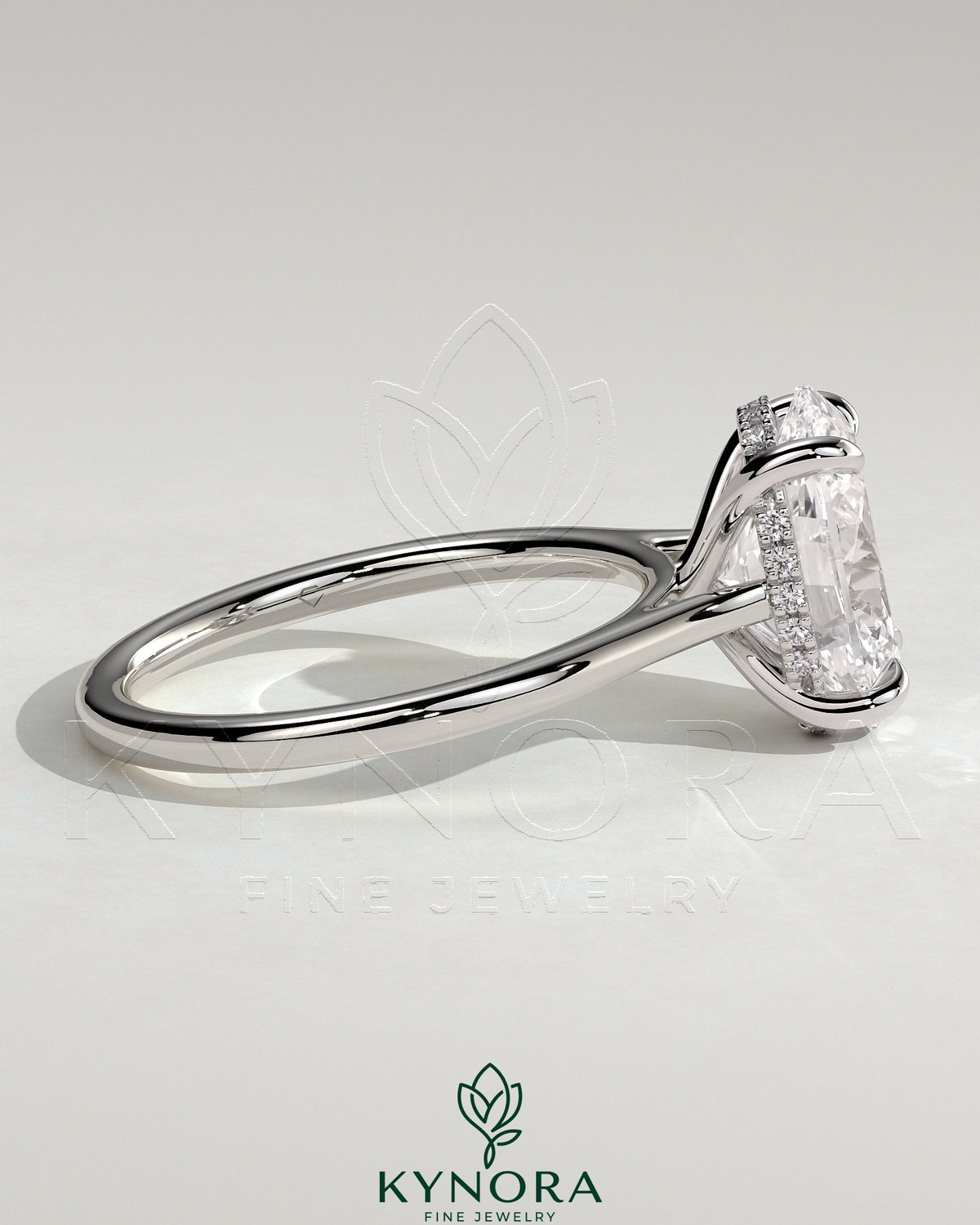 Kynora CJ 2ct oval claw solitaire engagement ring with hidden halo, tapered band, and cathedral high setting, showcasing elegant jewelry design.