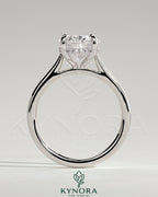 Kynora CJ 2ct oval claw solitaire engagement ring with hidden halo, tapered band, and cathedral high setting.