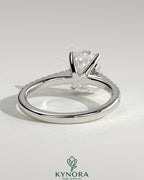 Kynora CJ 2ct oval claw solitaire engagement ring with pave band and cathedral low setting in sterling silver.