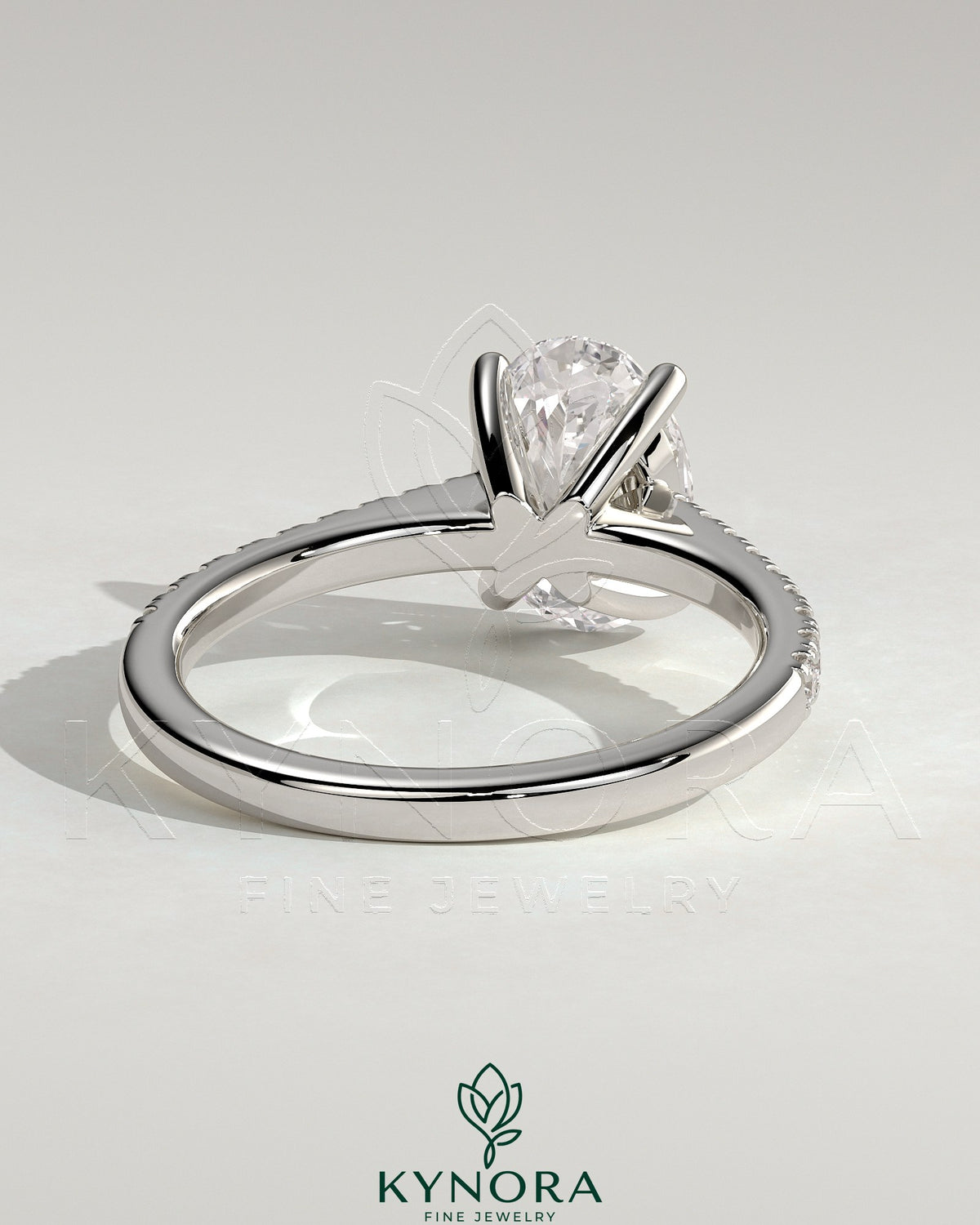 Kynora CJ 2ct oval claw solitaire engagement ring with pave band and cathedral low setting in sterling silver.