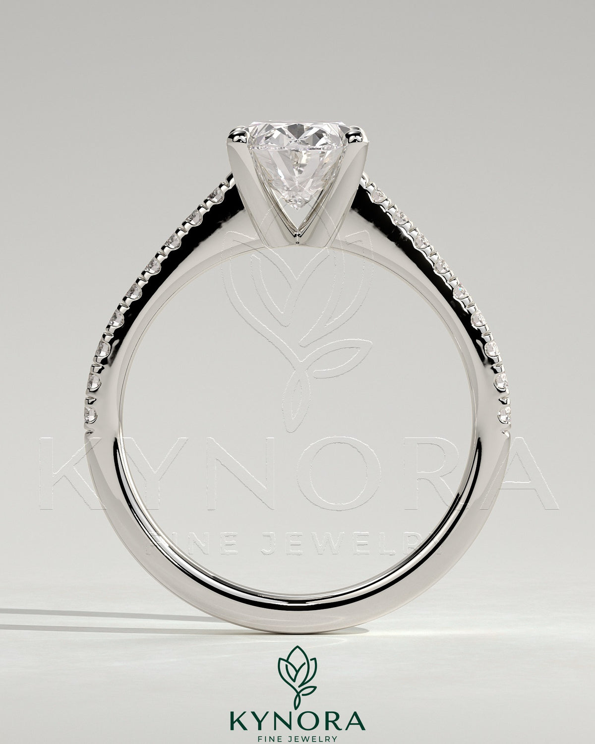 Kynora CJ 2ct oval claw solitaire engagement ring with pave band and cathedral low setting in sterling silver.