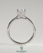 Kynora CJ 2ct oval claw solitaire engagement ring with petal gallery, leaf accents, and cathedral setting.