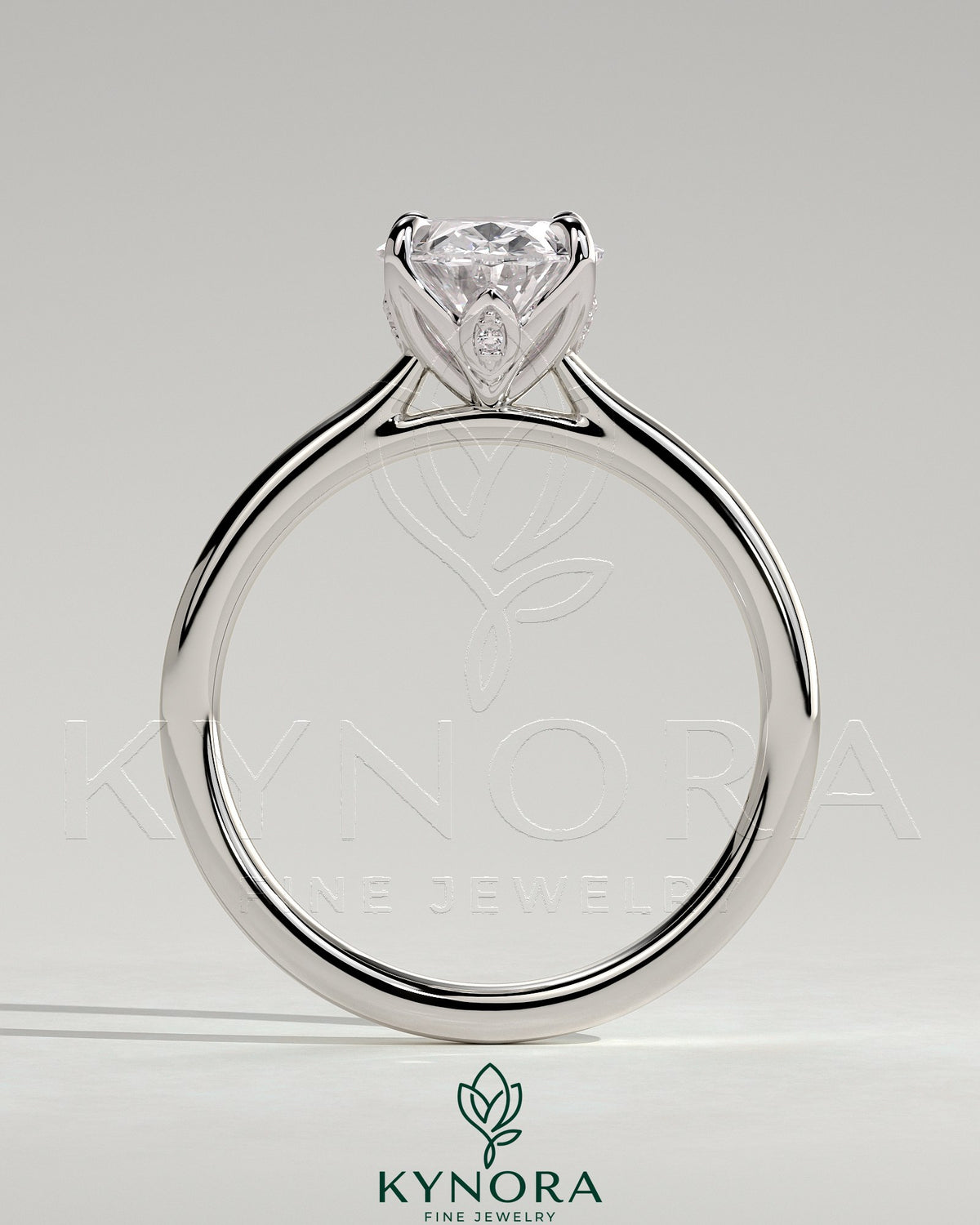 Kynora CJ 2ct oval claw solitaire engagement ring with petal gallery, leaf accents, and cathedral setting.