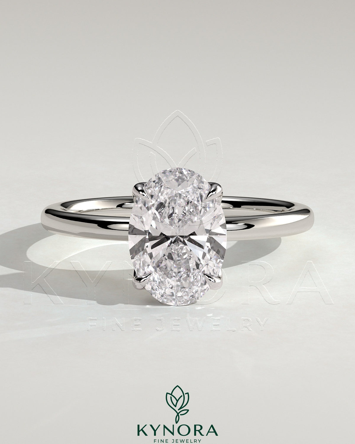 Kynora CJ 2ct oval claw solitaire engagement ring with petal gallery and leaf accents, showcasing intricate metalwork and a sparkling center stone.