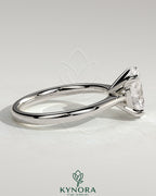 Kynora CJ 2ct oval claw solitaire engagement ring with pinched tapered band and cathedral low setting, showcasing elegant jewelry design.