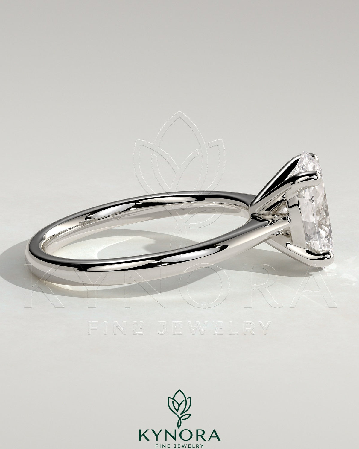 Kynora CJ 2ct oval claw solitaire engagement ring with pinched tapered band and cathedral low setting, showcasing elegant jewelry design.