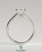 Kynora CJ 2ct oval claw solitaire engagement ring with pinched tapered band and cathedral low setting, showcasing elegant jewelry design.