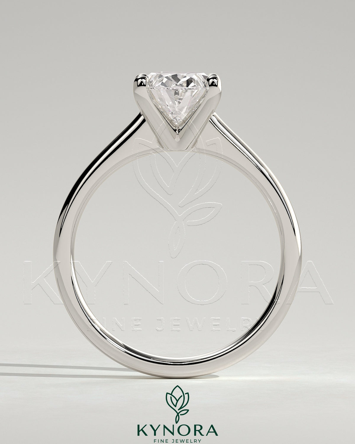 Kynora CJ 2ct oval claw solitaire engagement ring with pinched tapered band and cathedral low setting, showcasing elegant jewelry design.