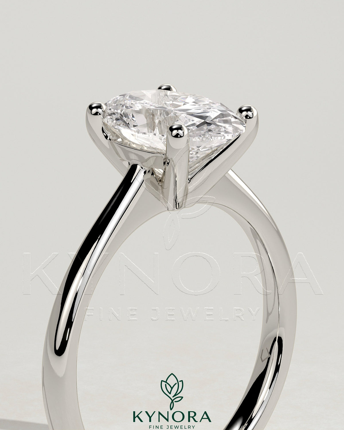 Kynora CJ 2ct oval claw solitaire engagement ring with pinched tapered band and cathedral low setting, showcasing elegant jewelry design.