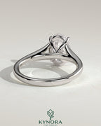 Kynora CJ 2ct oval claw solitaire engagement ring with split shank and cathedral high setting, showcasing elegant diamond design.