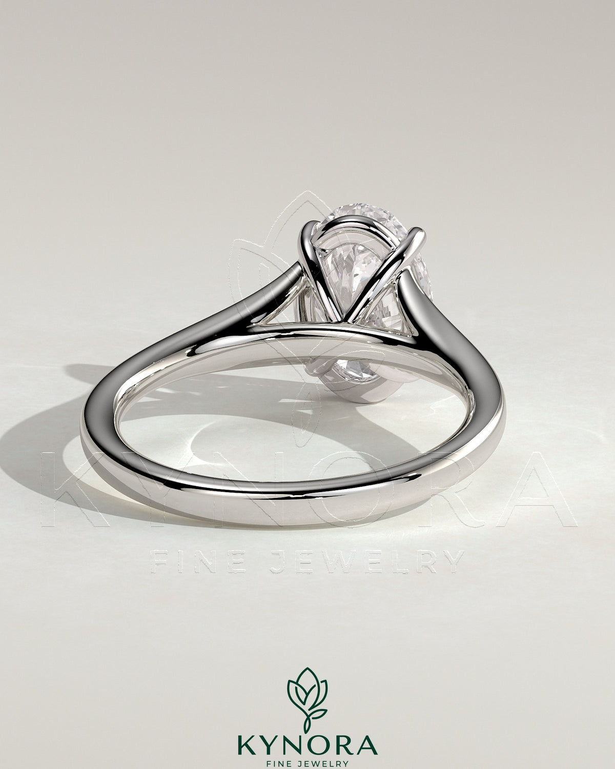 Kynora CJ 2ct oval claw solitaire engagement ring with split shank and cathedral high setting, showcasing elegant diamond design.