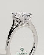 Kynora CJ 2ct oval diamond solitaire engagement ring with split shank and cathedral high setting, showcasing elegant craftsmanship.