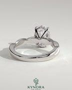 Kynora CJ 2ct oval claw solitaire engagement ring with twisted band in sterling silver, featuring a prominent oval diamond setting.