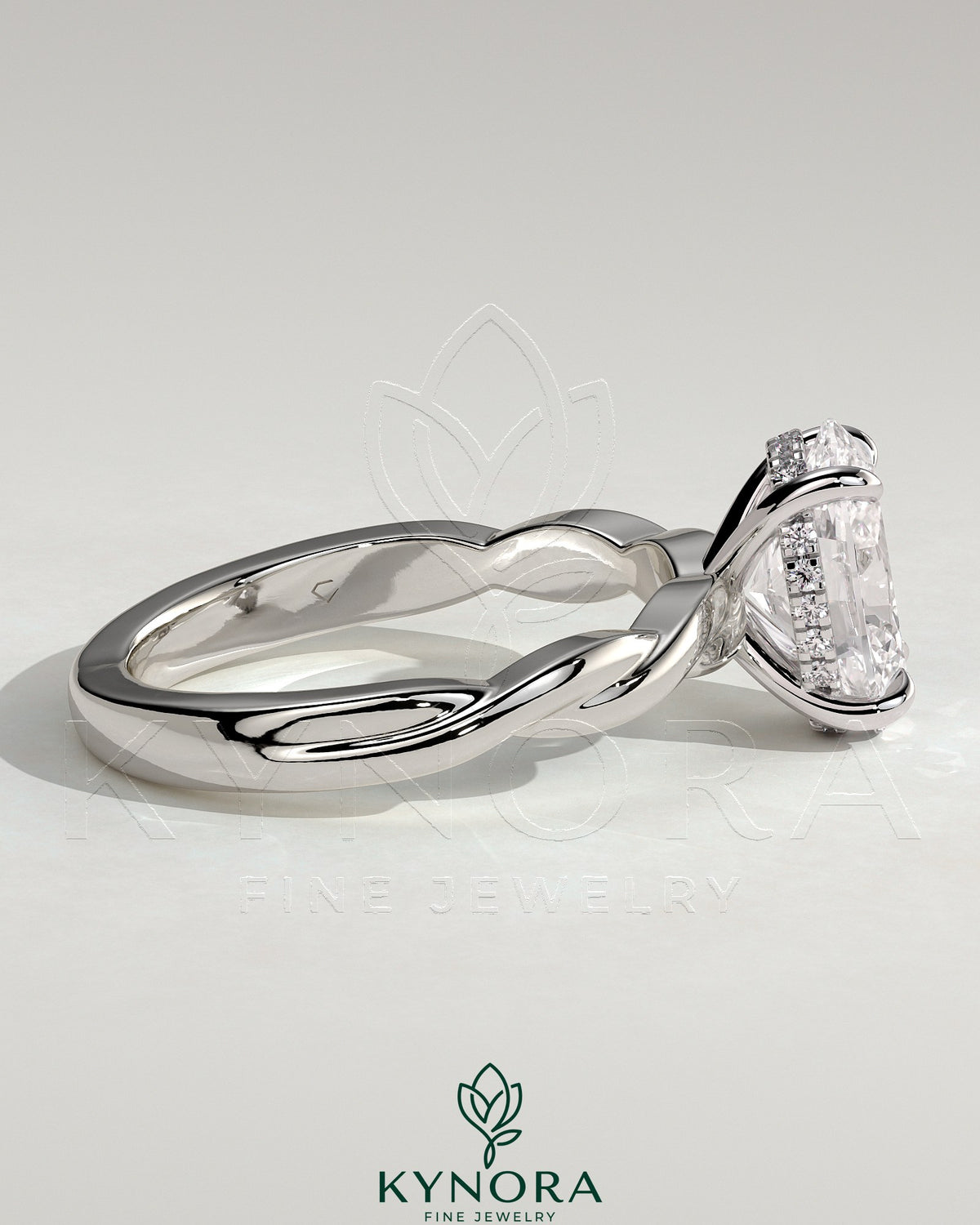 Kynora CJ 2ct oval claw solitaire engagement ring with twisted band, showcasing a sparkling oval diamond on a sleek gold band.