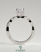 Kynora CJ 2ct oval claw solitaire engagement ring with twisted band, showcasing a sparkling oval diamond and intricate band design.