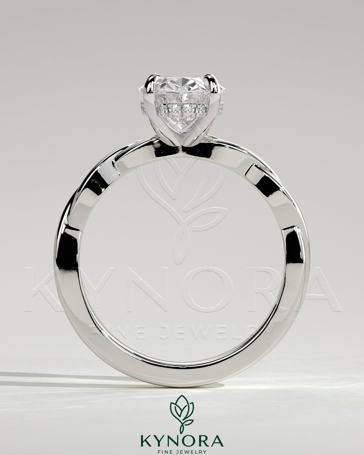 Kynora CJ 2ct oval claw solitaire engagement ring with twisted band, showcasing a sparkling oval diamond and intricate band design.