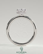 Kynora CJ 2ct oval claw solitaire engagement ring with a wrap-around hidden halo, showcasing elegant diamond setting.