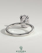 Kynora CJ 2ct oval double claw solitaire engagement ring with hidden halo, showcasing a sparkling oval diamond and elegant band.