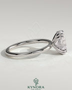 Kynora CJ 2ct oval double claw solitaire engagement ring with hidden halo, showcasing a sparkling center stone and elegant design.